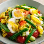 Refreshing Thai corn cucumber salad served in a bowl with vibrant ingredients
