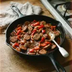 Delicious sausage and peppers served in a vibrant dish